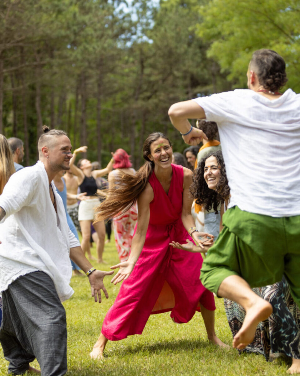 A group of people dancing joyfully outside