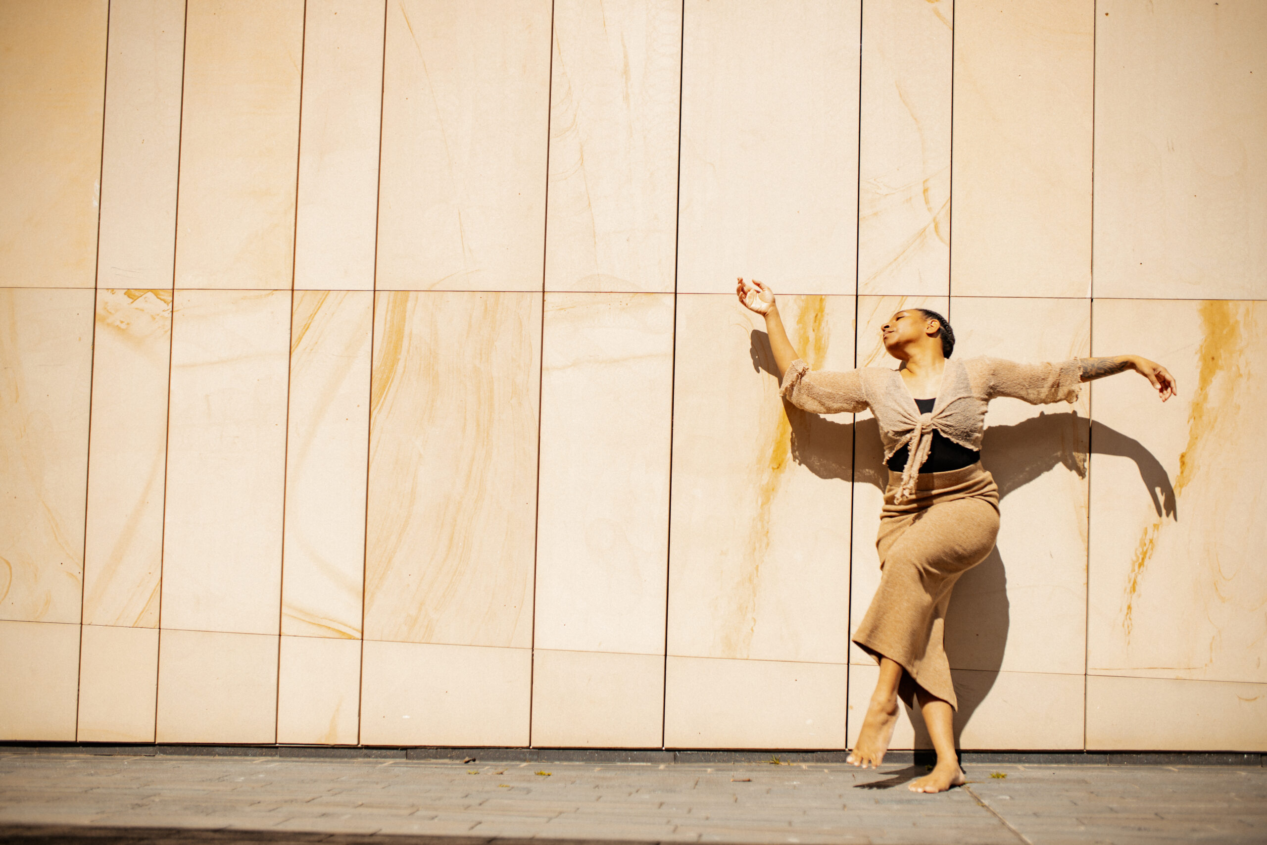 Dancer in flowy costume in the sunshine.