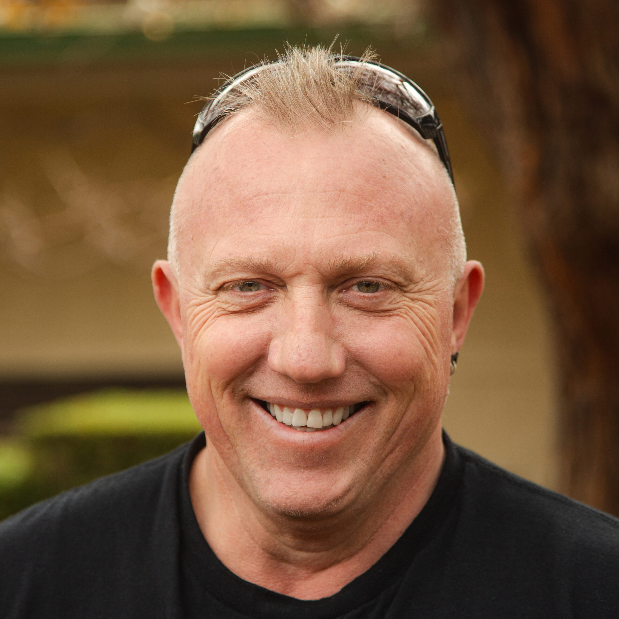 Portrait of Karl wearing a black shirt.